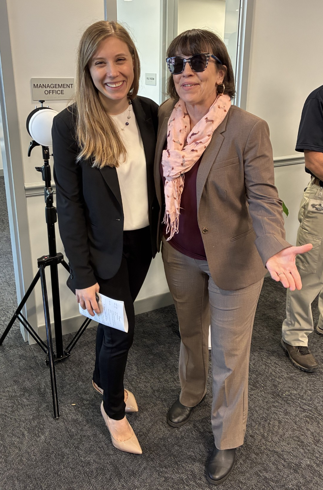 2 smiling women who worked hard on this development and are happy it is open