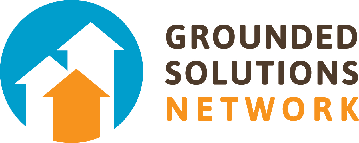 a logo: white and orange arrows pointed up on a blue background. The words "grounded solutions network"